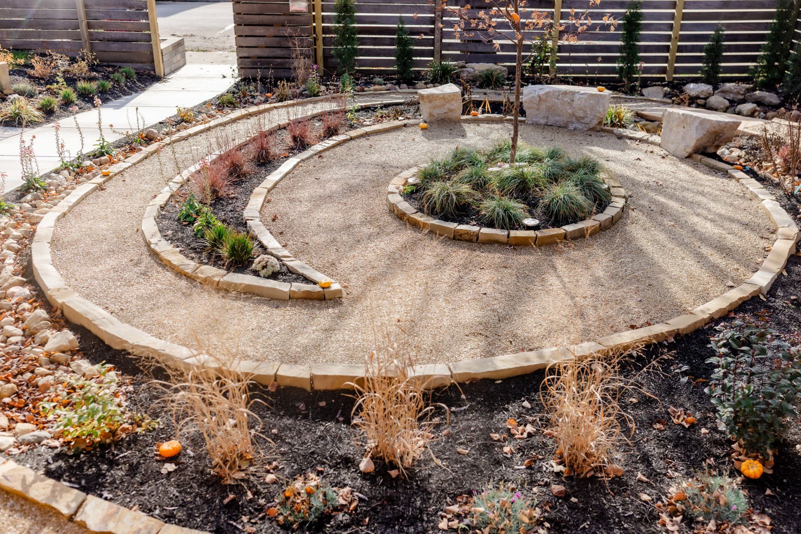 Aerial view of the two parcels with the spiral garden between the passive house and the main house